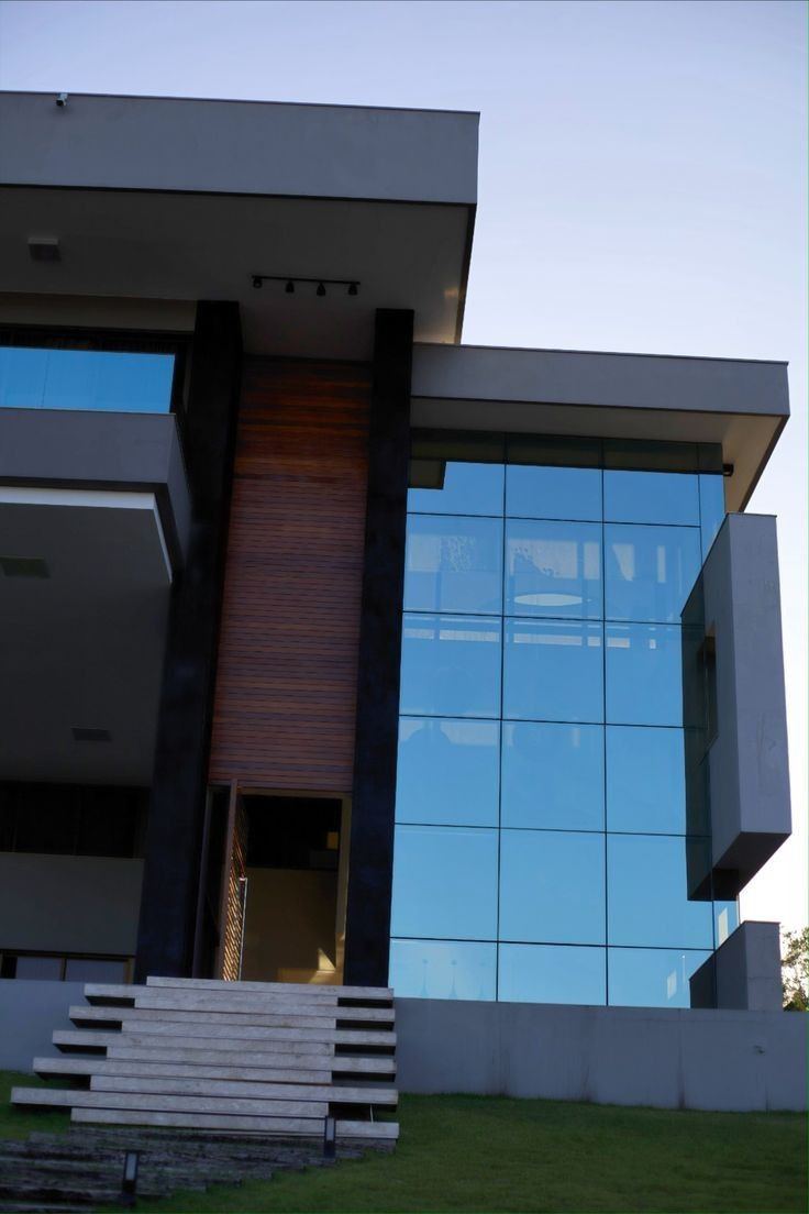 Frameless glass doors with stainless steel fittings in a commercial building